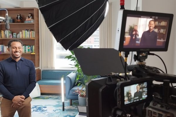 Two-camera interview filming setup with professional audio and lighting in a Dublin office